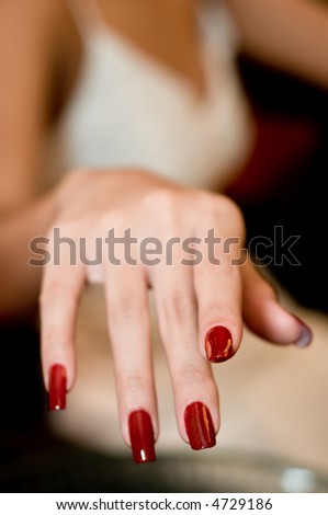 A close-up of a hand with newly painted nails