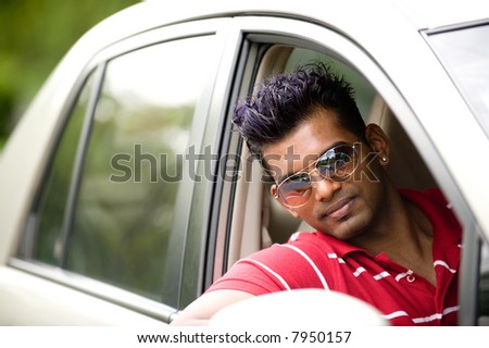 A cool young Asian man in car
