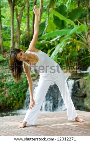 A young woman doing yoga outside