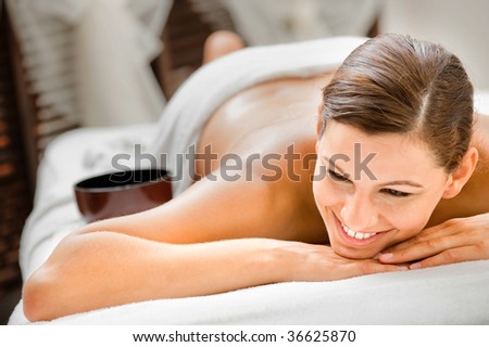 An attractive caucasian woman lying down in a spa