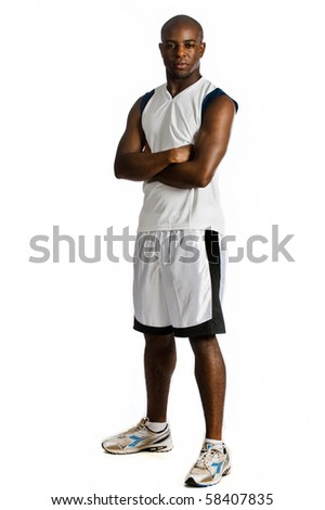 An attractive athletic man in sportswear against white background