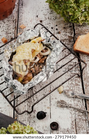 Grill meet with vegetables in foil