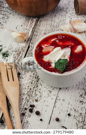 Traditional soup with beet on light background