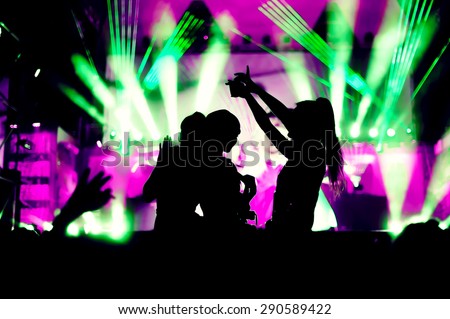 night club festival crowd hands up dance with girls silhouettes