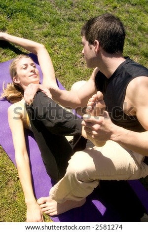 An attractive young couple work out in Central Park, New York.