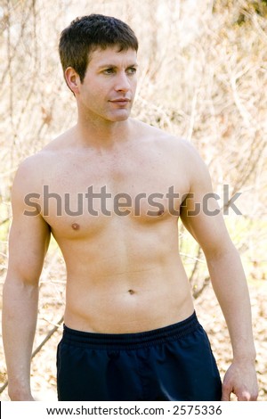 three quarter length shot of a young man with no shirt