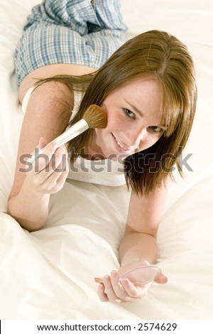 stock photo very attractive young teen girl in pajamas laying on her bed