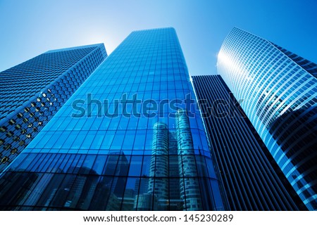 Generic unidentified business skyscrapers, sunny blue sky.