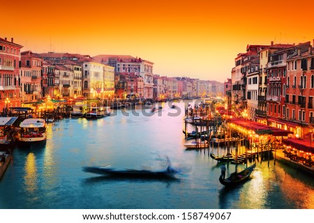 Venice, Italy. Gondola Floats On Grand Canal, Italian Canal Grande At Sunset. View From Rialto Bridge