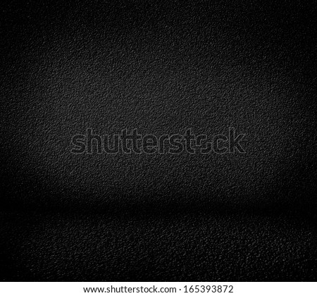 Black minimalist grainy wall background and black floor. High resolution, good for templates, backgrounds, textures.