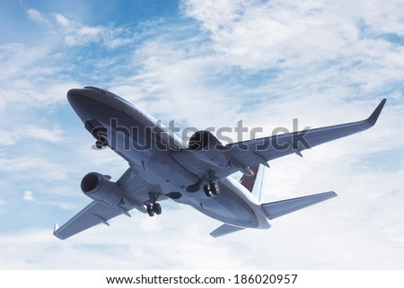 Airplane taking off. A big passenger or cargo aircraft, airline flying. Transportation, transport, business in motion.