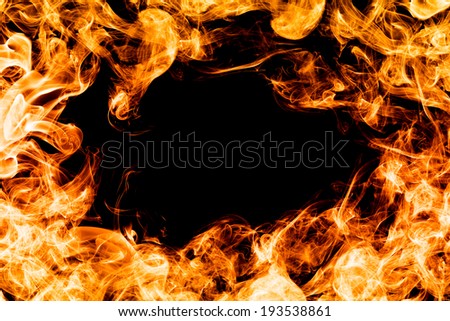 Fire flames on black background making a frame, border. Perfect for design, as graphic element or template background.
