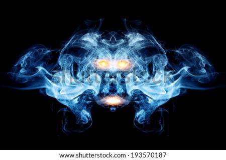 Abstract face made of smoke, flames. May be the concept of ghost, devil, logo element, background