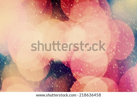 Christmas background of true camera bokeh. Snow blizzard texture. Glitter and light abstract.