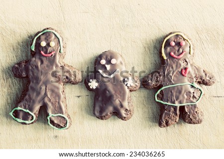 Gingerbread family. Handmade in home, decorated by children. Vintage Christmas