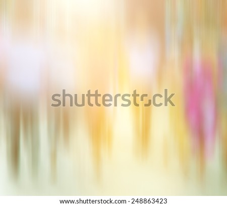 Blurred image of crowd of busy people walking on the street. Blur background