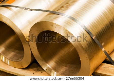 Industrial hardened steel cylinders in workshop. Industry, heavy engineering.