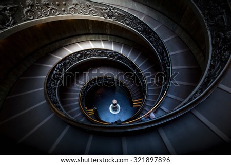Long spiral, winding stairs. Dark shadows, mysterious mood with single soft light.