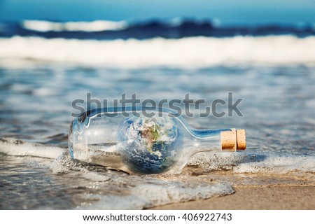 Earth in the bottle coming with wave from ocean. Concept of environment, nature care, save clean world message. Elements of this image furnished by NASA