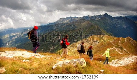 Tatra Mountains stormy landscape panorama and hikers walking