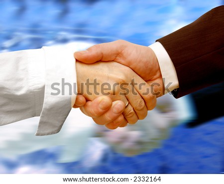 Business handshake on water background