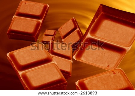 Little bars of chocolated falling into melted chocolate mass
