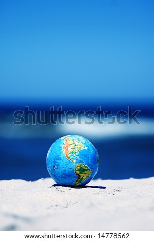 Earth globe on the beach. Ideal for Earth protection concepts, recycling, world issues, enviroment themes