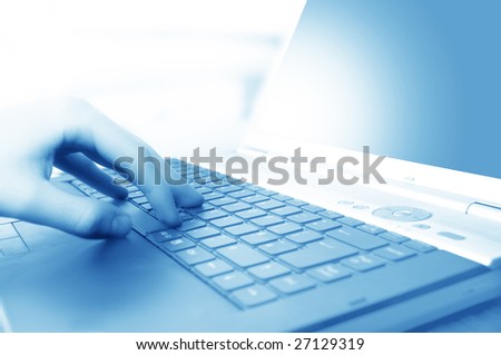 Modern business equipment. Typing on keyboard