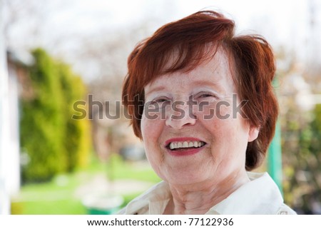 Happy senior woman smiling outdoor