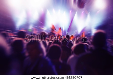 Crowds of people having fun on a music concert