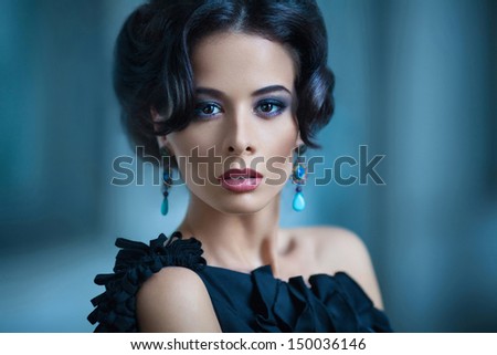 Elegant woman in black cocktail dress