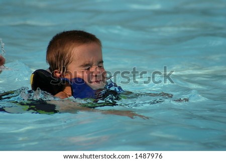 Boy with Eyes Shut in Pool