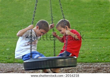Boys on Tire Swing with motion blur