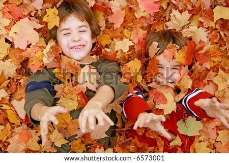 Boys Throwing Fall Leaves Boys Throwing Fall Leaves