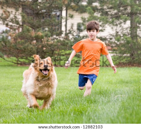 Little Boy Racing the Dog