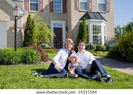 Family in Front of House