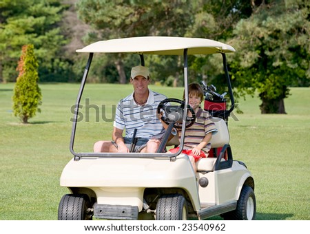 Father and Son in Golf Cart