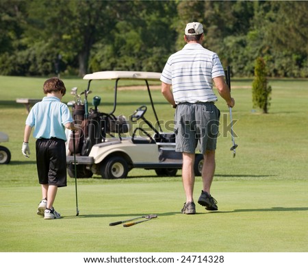 Father and Son Playing Golf