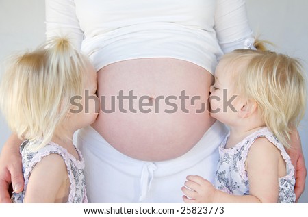 Twins Kissing Pregnant Belly