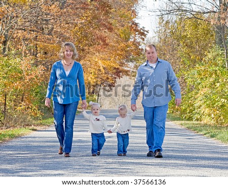 Family Taking a Walk in the Autumn