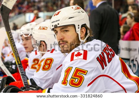 RALEIGH, NC â?? January 24, 2014: Calgary Flames right wing Kevin Westgarth during the NHL game between the Calgary Flames and the Carolina Hurricanes at the PNC Arena.