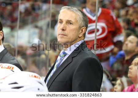 RALEIGH, NC â?? January 24, 2014: Calgary Flames head coach Bob Hartley during the NHL game between the Calgary Flames and the Carolina Hurricanes at the PNC Arena.