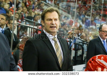 RALEIGH, NC â?? November 7, 2013: Carolina Hurricanes head coach KIRK MULLER during the NHL game between the New York Islanders and the Carolina Hurricanes at the PNC Arena.