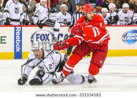 RALEIGH, NC  October 11, 2013: Carolina Hurricanes right wing Kevin Westgarth (8) and Los Angeles Kings defenseman Alec Martinez (27) during the NHL game.