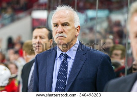 RALEIGH, NC  March 23, 2015: Chicago Blackhawks head coach Joel Quenneville during the NHL game between the Chicago Blackhawks and the Carolina Hurricanes at the PNC Arena.