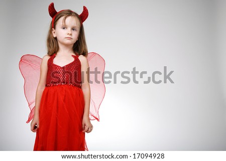 Cute little girl in Halloween costume.