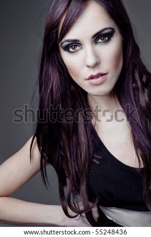 Young beautiful brunette fashion model with long hair.