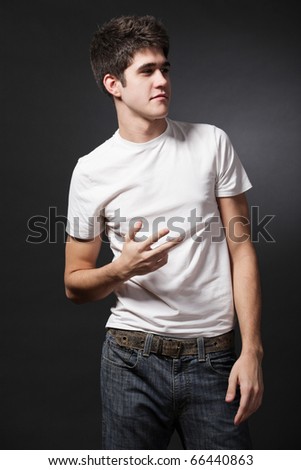 Young attractive happy man wearing white T-shirt.