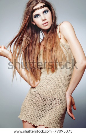 Young beautiful European fashion model with long blond hair.