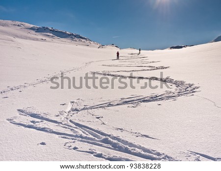 Family skiing making curves in the snow at easter in the norwegian mountain at Laerdal